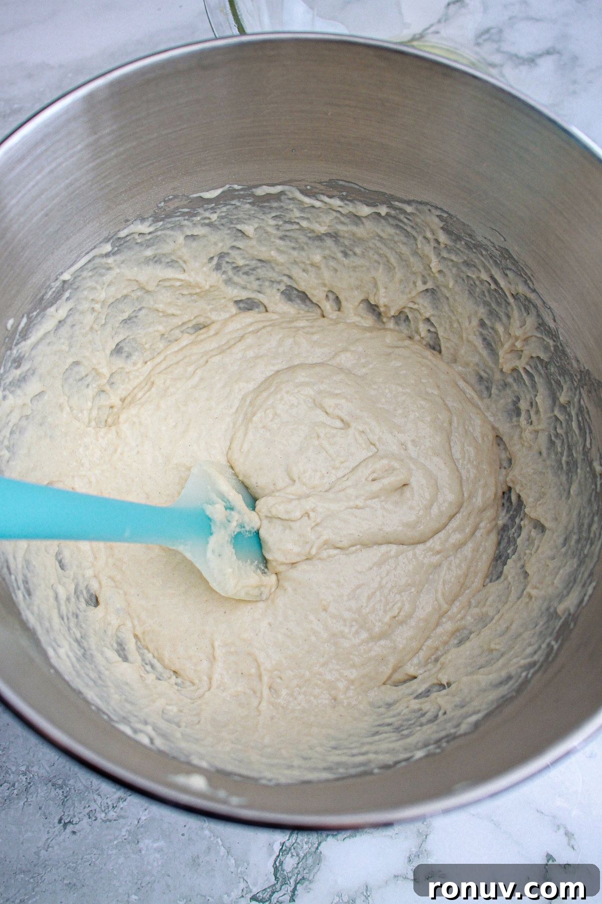 Tomato Focaccia: Classic Italian Bread 5 dough being mixed in a stainless steel mixing bowl.