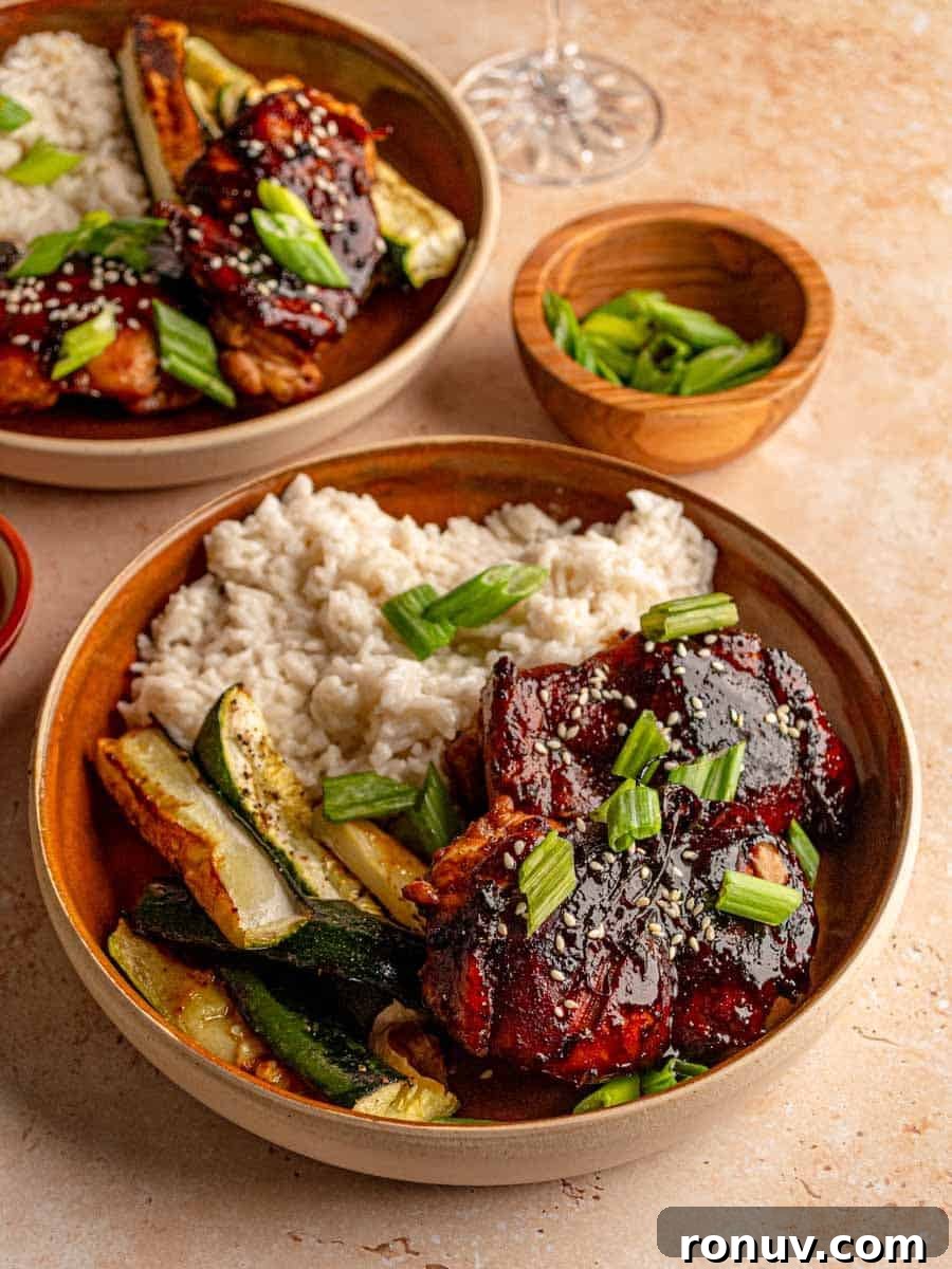 Sticky Honey Garlic Chicken Thighs for Quick Weeknight Dinner 7 Honey garlic chicken on a plate with rice.