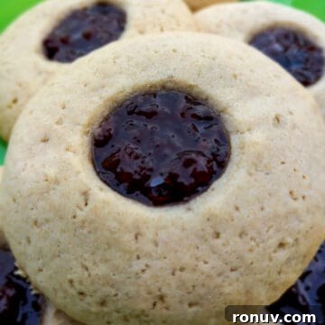 raisin-filled cookies on a green tree plate.