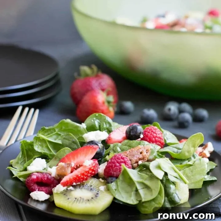 Kiwi and Berry Spinach Salad with Honey Poppy Seed Dressing 2 Kiwi Berry Spinach Salad with Honey Poppy Seed Dressing. Creamy goat cheese and candied pecans top this colorful salad with a dressing that's not too sweet!