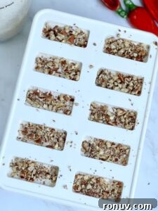 Mexican Pecan Paletas Recipe: Creamy Pecan Popsicles 7 Pouring paleta mixture into molds