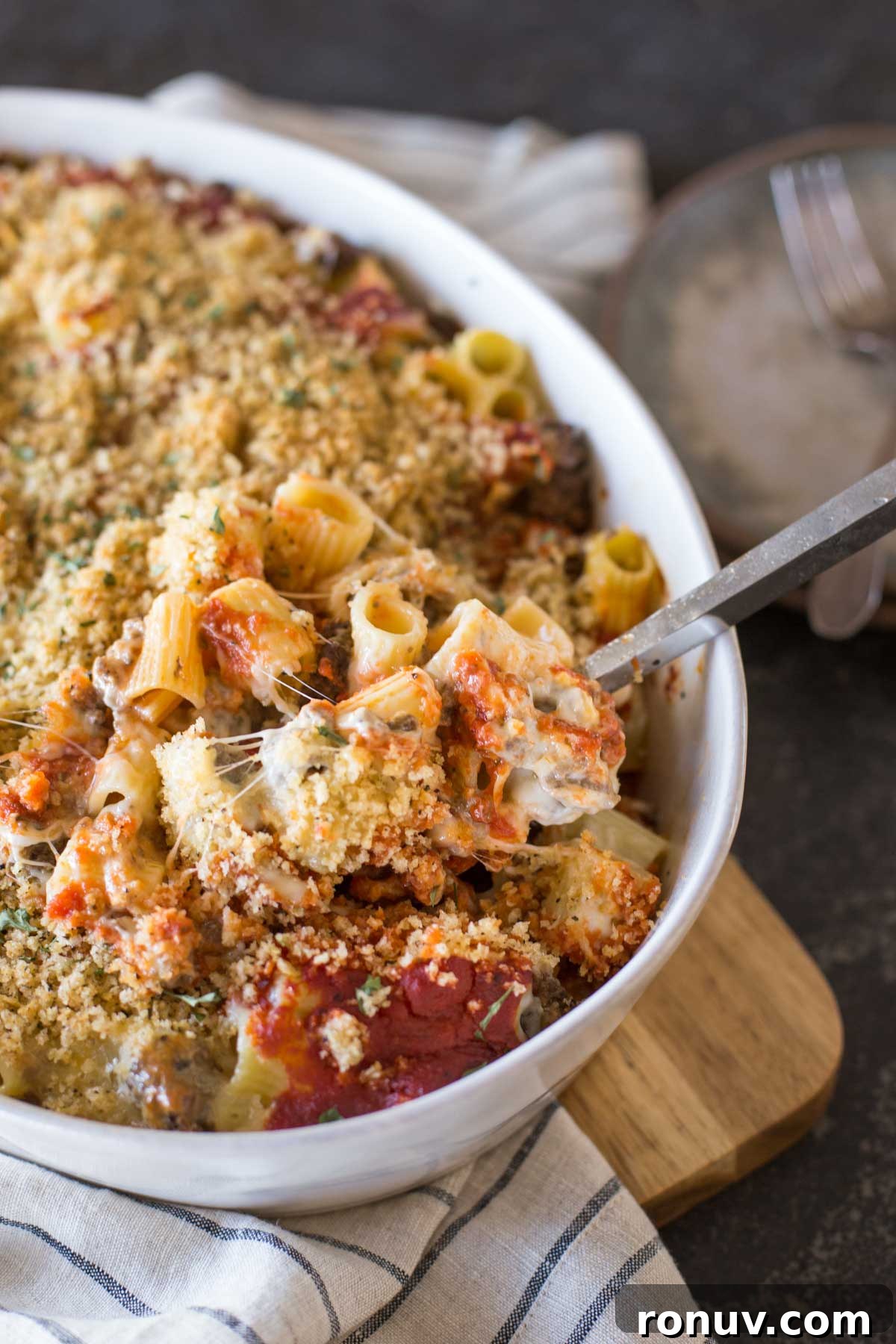 Creamy Tomato Alfredo Pasta Bake with Melted Mozzarella 3 Cheesy Tomato Alfredo Pasta Bake in a baking dish.