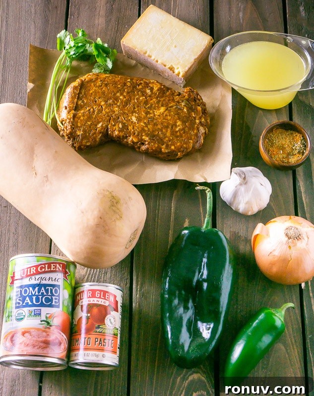 Oven-Baked Chorizo and Butternut Squash Chiles Rellenos 3 The ingredients for chorizo-butternut squash chile rellenos: butternut squash, chorizo, cilantro, cheese, chicken stock, spices, garlic, onion, jalapeno, pasilla pepper, tomato sauce and tomato paste.