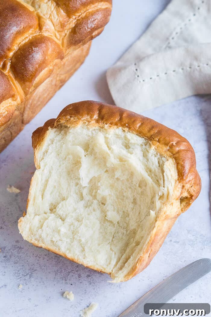 Vegan Hokkaido milk bread A chunk of torn vegan milk bread on a grey background